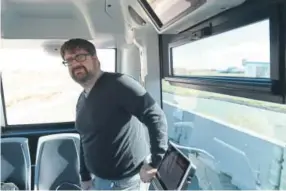  ?? Lindsay Pierce, The Denver Post ?? Christian Elmiger, an engineer with EasyMile, the French developer that opened its U.S. headquarte­rs in Denver this year, rides the EZ-10 driverless shuttle Monday.