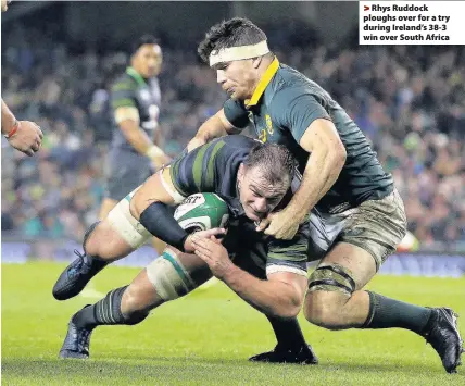  ??  ?? > Rhys Ruddock ploughs over for a try during Ireland’s 38-3 win over South Africa