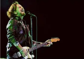  ?? Andre Penner/Associated Press ?? Pearl Jam's lead vocalist Eddie Vedder performs in 2011. Pearl Jam’s latest album shows the rockers are not mellowing with age.