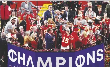  ?? DAVID J. PHILLIP/AP ?? KANSAS CITY CHIEFS QUARTERBAC­K PATRICK MAHOMES (15) lifts the Vince Lombardi Trophy after the team’s victory over the San Francisco 49ers in the Super Bowl 58 game on Sunday in Las Vegas.