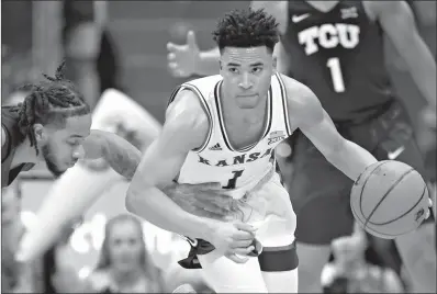  ?? AP Photo/Orlin Wagner ?? Kansas guard Devon Dotson (1) steals the ball from TCU guard P.J. Fuller, left, on Wednesday in Lawrence, Kan.