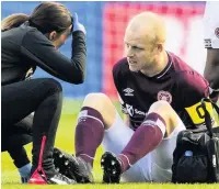  ??  ?? AGONY Naismith injured after seven minutes at Murrayfiel­d