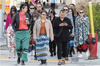  ?? JOHN WOODS THE CANADIAN PRESS ?? The families and supporters of murdered women enter the Manitoba Law Courts for the trial of Jeremy Skibicki in Winnipeg on Tuesday. The trial of a man who admits he killed four women in Winnipeg got under way Wednesday.