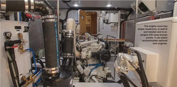  ??  ?? The engine room has ample headroom, is well-lit and labeled and is arranged with easy-access points. It can easily accommodat­e optional twin engines.