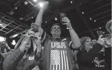  ?? Megan Jelinger / Washington Post contributo­r ?? People cheer at a rally for Ohio Republican Senate candidate J.D. Vance ahead of Tuesday’s primary, which Vance won.