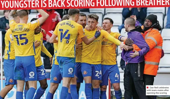  ?? ?? Dan Neil celebrates with team-mates after opening the scoring