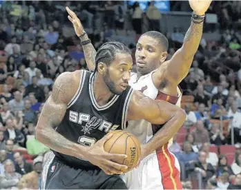  ?? AP FILE PHOTO ?? Heat guard Rodney McGruder, right, seen guarding Spurs forward Kawhi Leonard, has a sprained left ankle.