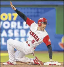  ?? MIKE EHRMANN / GETTY IMAGES ?? Freddie Freeman faced toptier pitching — which probably wouldn’t have occurred in spring training — while playing for Canada in the World Baseball Classic. He’s back with the Braves after Canada’s eliminatio­n.