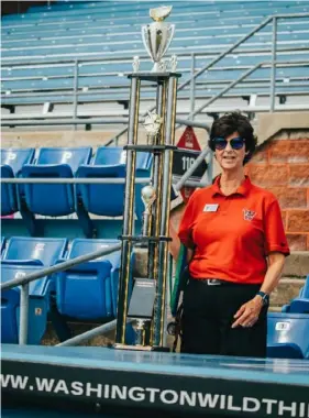  ?? Sports Facility LLC ?? Christine Blaine’s No. 1 goal is for the Washington Wild Things to win the Frontier League championsh­ip. This trophy is for the winner of a corporate softball game held each year at Wild Things Park in North Franklin.