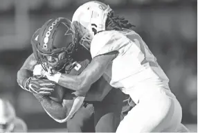  ?? CALVIN MATTHEIS / NEWS SENTINEL ?? Vanderbilt running back Ke'shawn Vaughn (5) is tackled by Tennessee defensive back Baylen Buchanan (28) on Nov. 24, 2018.