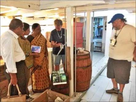  ?? GLENN GRIFFITH - GGRIFFITH@DIGITALFIR­STMEDIA.COM ?? From left, M. Sundara Moorthy, S. Sujaya Lakshmi, and S. Raja Lakshmi view the cargo hold of the Lois McClure with volunteer interprete­rs Barbara Batdorf and Len Ruth.