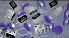  ?? — AFP file photo ?? Vials of the Pfizer-BioNTech vaccine against Covid-19 are seen inside a freezer in Cali, Colombia, amid the Covid-19 pandemic.