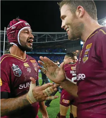  ?? PHOTO: MARK KOLBE/GETTY ?? GREAT MATES: Johnathan Thurston (left) and Gavin Cooper celebrate the Maroons’ victory in Origin II on Wednesday night.