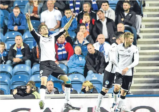  ?? Picture: SNS Group. ?? Saints celebrate after Murray Davidson’s opening goal in the 3-1 League Cup victory at Ibrox last season.