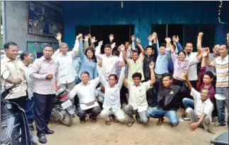  ?? SUPPLIED ?? CNRP activist Chan Sithat (second row, fifth from left) celebrates with other CNRP members after their victory in the local elections in Pailin’s Stung Kach commune in June.