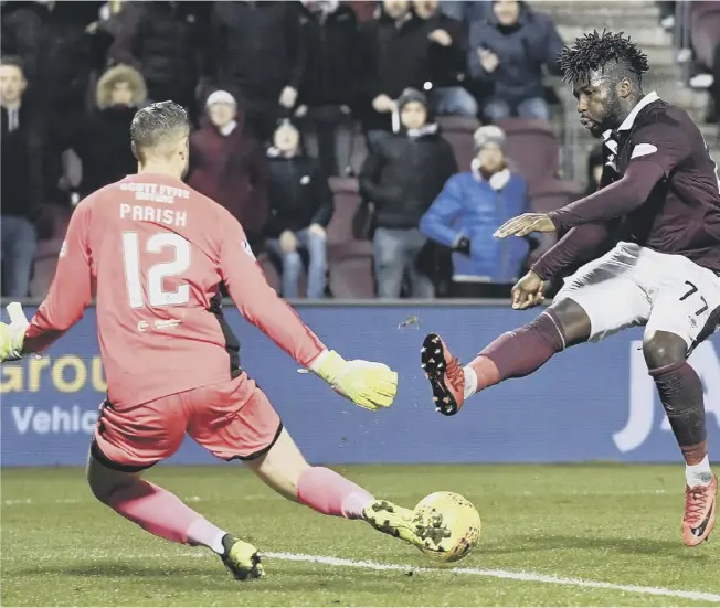  ??  ?? 0 Esmael Goncalves slots the ball past Dundee keeper Elliot Parish to open the scoring for Hearts on the half-hour mark on a night when 16-year-old attacking midfielder Anthony Mcdonald, above, impressed on his debut for the home side.