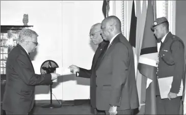  ??  ?? This Ministry of the Presidency photo shows Dr. Alfonso Munera Cavadia (left) presenting his letters of credence to President David Granger. At right is Minister of State Joseph Harmon.