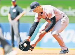  ?? Getty Images ?? GAVE IT THE BOOT: Anthony Rizzo commits an error during the second inning on Sunday in Cleveland.