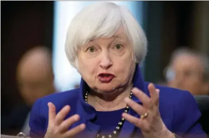  ?? THE ASSOCIATED PRESS ?? Federal Reserve Chair Janet Yellen testifies on Capitol Hill in Washington on Feb. 14 before the Senate Banking Committee. The Fed seems all but sure to raise rates this week and to signal that more hikes are likely coming. Fed watchers appear buoyed...