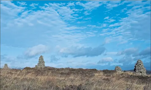  ??  ?? Although the summit of Castle Dow is featureles­s bar half a dozen cairns, on a good day it makes an excellent viewpoint