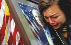  ?? Reuters ?? Vietnam-born US citizen Mai Tran mourns near a portrait of Senator John McCain after she paid respect to him at the US embassy in Hanoi, Vietnam, yesterday.
