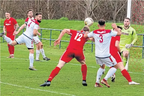  ??  ?? Action from last week’s Super League game between Carnoustie (red) and Scone Thistle. The Gowfers won 5-0.