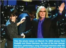  ??  ?? This file photo taken on March 15, 2004 shows Tom Petty(R) and Dhani Harrison, the son of the late George Harrison, performing a song of George Harrison after the late Beatle was inducted during the 19th Annual Rock and Roll Hall of Fame Induction...