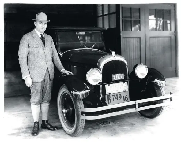  ?? — FCA FILES ?? Walter Chrysler shows off the first car to bear his name in 1924.