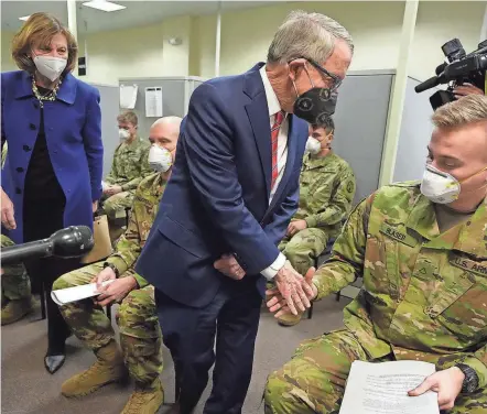  ?? ?? Ohio Gov. Mike Dewine visited the Defense Supply Center Columbus on Thursday as approximat­ely 100 members of the Ohio National Guard reported for duty.