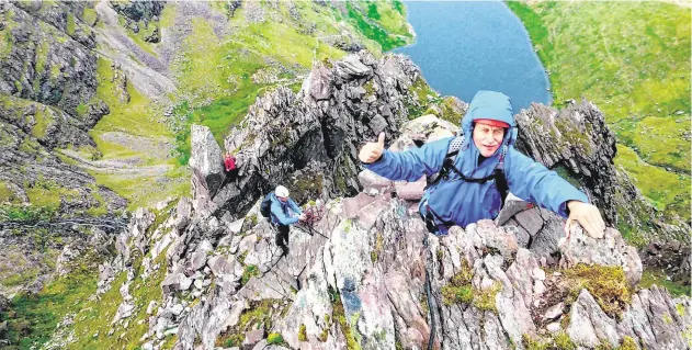  ??  ?? Spectacula­r: Climbers enjoy the sights of the McGillycud­dy Reeks in Co Kerry.