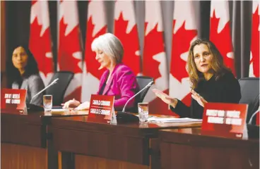  ?? Blair Gable / Reuters ?? Deputy Prime Minister Chrystia Freeland, Minister of Health Patty Hajdu and Chief Public Health Officer Dr. Theresa Tam at a COVID -19 news conference in Ottawa Thursday. There were a lot of sombre numbers coming out of Ottawa on Thursday, John Ivison writes.