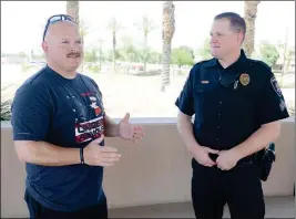  ?? Buy this photo at YumaSun.com PHOTO BY RANDY HOEFT/YUMA SUN ?? YUMA POLICE DEPARTMENT’S OFFICER OF THE YEAR, Cory Williams (left), talks with Sgt. Michael Wilcher, who is YPD’s Supervisor of the Year.