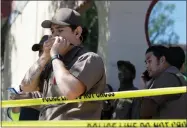  ?? AP PHOTO BY ERIC RISBERG ?? UPS workers gather outside a UPS package delivery warehouse where a shooting took place Wednesday in San Francisco. A UPS spokesman says four people were injured in the shooting at the facility and that the shooter was an employee.