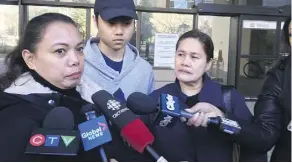  ?? PAIGE PARSONS ?? Relatives of Ricky Massin Cenabre, who was shot and killed while working in an Edmonton convenienc­e store on Dec. 18, 2015, speak outside the courthouse on Monday.