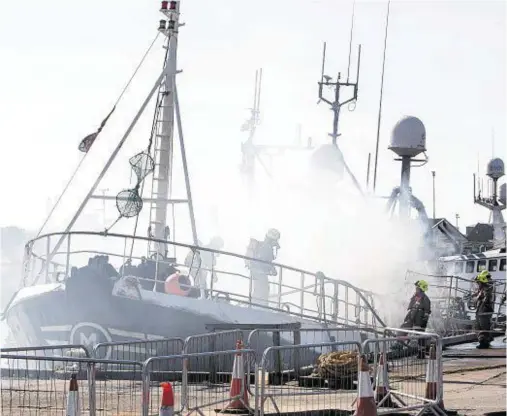  ??  ?? BLAZE: In August last year more than 30 firefighte­rs tackled the fire on the trawler Ardent II in Peterhead harbour for two days