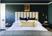  ?? MARY COSTA — CAITLIN MURRAY VIA AP ?? This undated photo provided by Caitlin Murray shows a bedroom designed by Caitlin Murray, founder of Black Lacquer Design in Los Angeles. The room features a vintage abstract portrait. Murray often hunts for portraits like this at flea markets or...