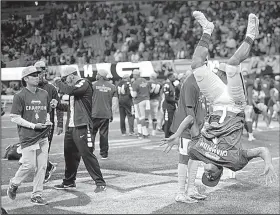  ?? AP/ANDREW KRECH ?? North Carolina A&T players celebrate after beating Grambling State 21-14 in the Celebratio­n Bowl on Saturday in Atlanta. The victory was North Carolina A&T’s second in the Celebratio­n Bowl in the past three years.