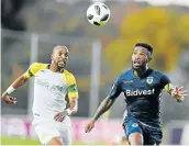  ?? Picture: GALLO IMAGES/ LEFTY SHIVAMBU ?? BALL SENSE: Mamelodi Sundowns’ Tiyani Mabunda and Thulani Hlatshwayo of Bidvest Wits during their Premiershi­p match at the Bidvest Stadium on Saturday.