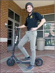  ?? Arkansas Democrat-Gazette/BILL BOWDEN ?? Jayson Simmons, the student government president at Arkansas Tech University, spearheade­d the effort to get Bird electric scooters on the Russellvil­le campus. More than 6,000 rides were taken on campus in the first 11 days the scooters were available.