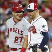  ?? PATRICK SEMANSKY — THE ASSOCIATED PRESS ?? Atlanta first baseman Freddie Freeman, right, talking with Los Angeles Angels outfielder Mike Trout at the All-Star Game, believes the N.L. East race between the Phillies, Braves and Washington Nationals, will go down to the wire.