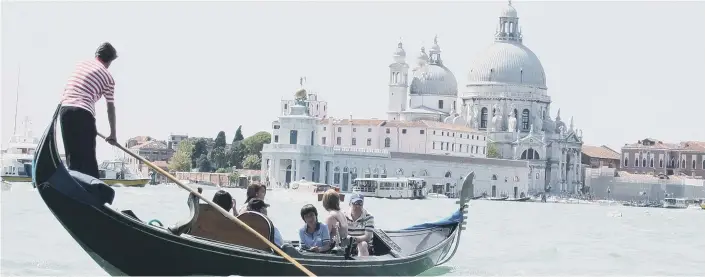  ??  ?? A ride in a Gondola - the only way to see the sights of Venice.