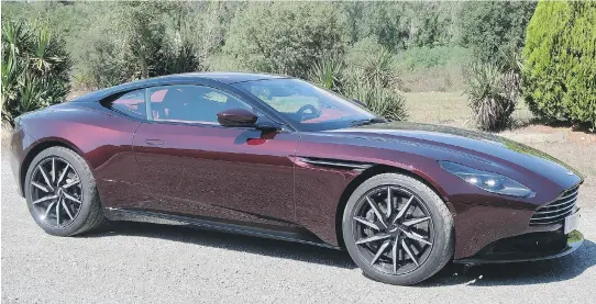  ?? JIL MCINTOSH/DRIVING ?? The 2018 Aston Martin DB11 V8, priced at a mere $233,650, isn’t just an entry-level Aston Martin. It competes very well with the DB11 V12.