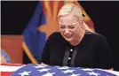  ?? AP ?? Meghan McCain cries at her father’s casket on Wednesday.