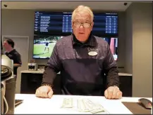  ?? WAYNE PARRY - THE ASSOCIATED PRESS ?? Frank Caltagiron­e, a sports book employee at the Ocean Casino Resort in Atlantic City, N.J., counts money from his drawer Monday.