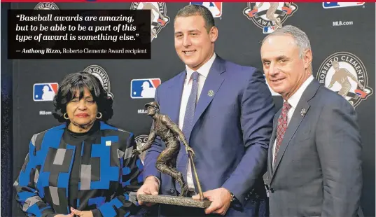  ?? — Anthony Rizzo, Roberto Clemente Award recipient | CHRIS CARLSON/ AP ?? The Cubs’ Anthony Rizzo poses with MLB commission­er Rob Manfred and Vera Clemente, Roberto Clemente’s widow, as he receives his award Friday.