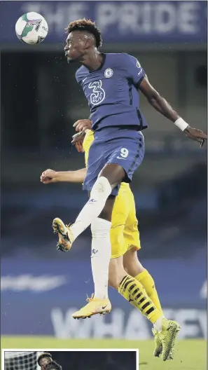  ?? PICTURES: PA ?? CASE OF THE BLUES: Chelsea’s Tammy Abraham towers above the Barnsley defence. Inset, Kai Havertz celebrates with Abraham as Barnsley goalkeeper Brad Collins appears dejected.