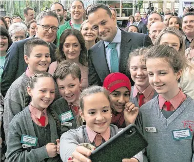  ?? PHOTO: GARETH CHANEY/COLLINS ?? Snappy: Leo Varadkar and Derek Allgood, eBay vicepresid­ent, global customer experience, pose for a selfie by Sophia Samson O’Kelly (11) during a visit to eBay.