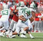  ?? KYLE ROBERTSON/COLUMBUS DISPATCH ?? Oregon running back Travis Dye carries the ball Saturday. The Buckeyes gave up 7.08 yards per carry.