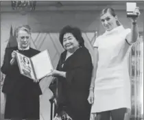  ?? BERIT ROALD, THE ASSOCIATED PRESS ?? Representa­tives of the Internatio­nal Campaign to Abolish Nuclear Weapons receive their Nobel Peace Prize awards in Oslo, Norway.