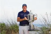  ?? GREGORY SHAMUS / GETTY IMAGES / TNS ?? Phil Mickelson holds the Wanamaker Trophy after winning the 2021 PGA Championsh­ip held at the Ocean Course of Kiawah Island Golf Resort in Kiawah Island, South Carolina.